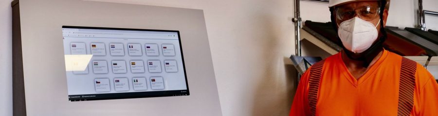 Production Operative at Sign-In Portal during Covid-19 operations.