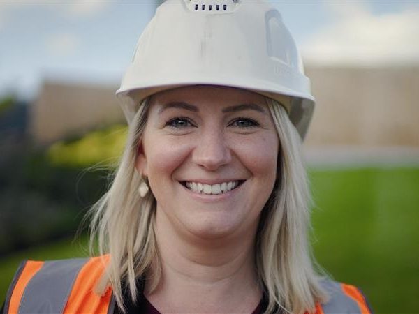 Women in hard hat and high viz vest