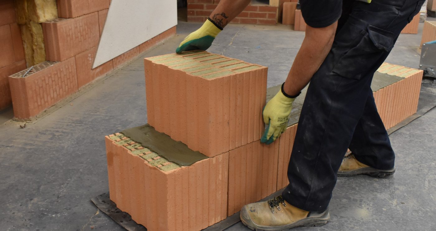 Man placing Porotherm monolithic brick