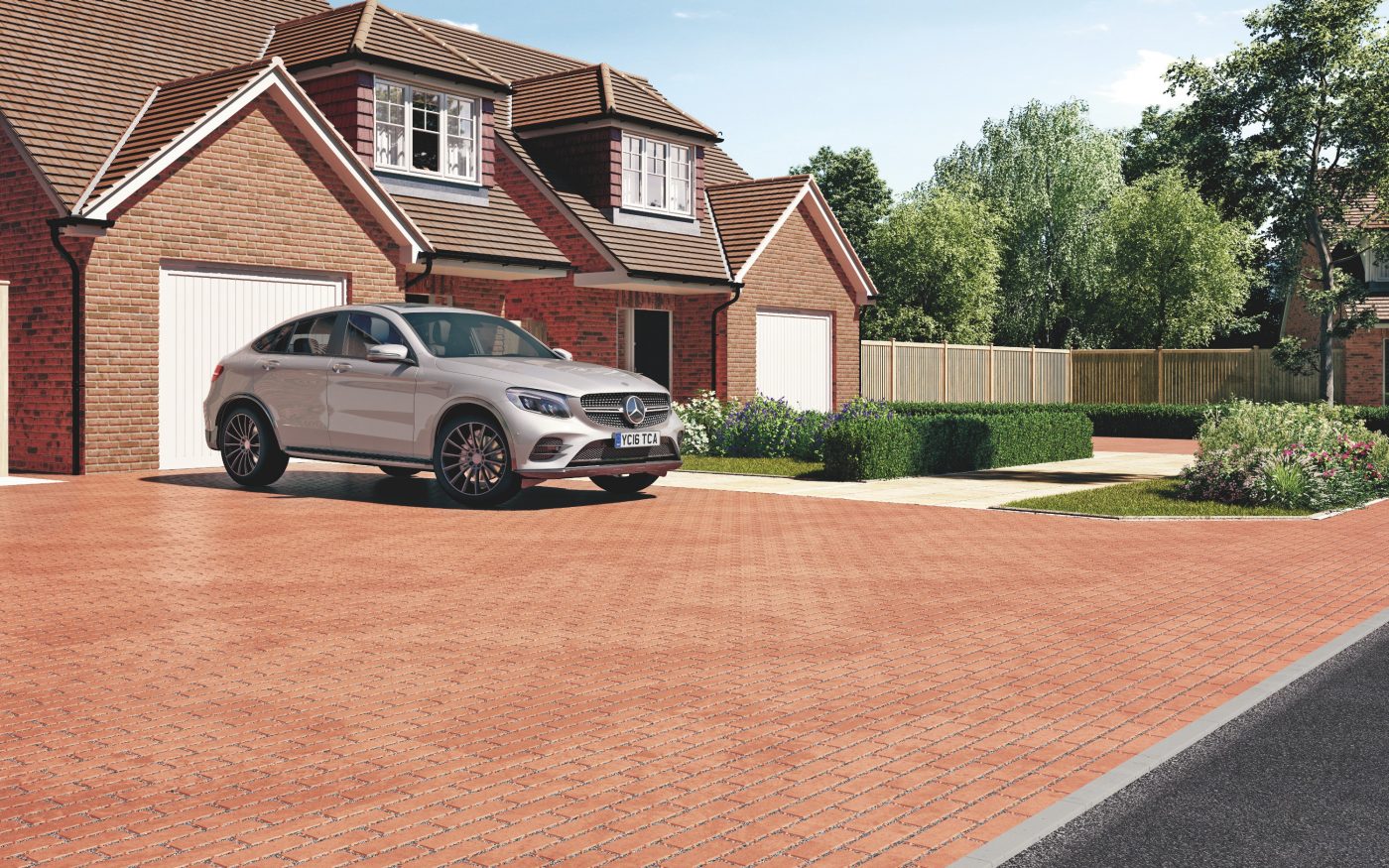 Red aquata pervious pavers used for residential driveway