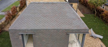 Modern tiled extension on Cotswolds cottage