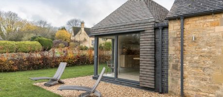 Exterior of modern extension with vertical tiling using bespoke handmade tiles