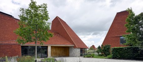 Drive way up to the unqiue style oust house