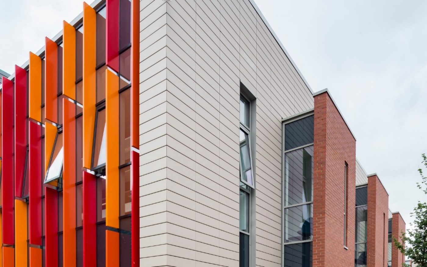 Two women walking past CUBRIC building in Cardiff