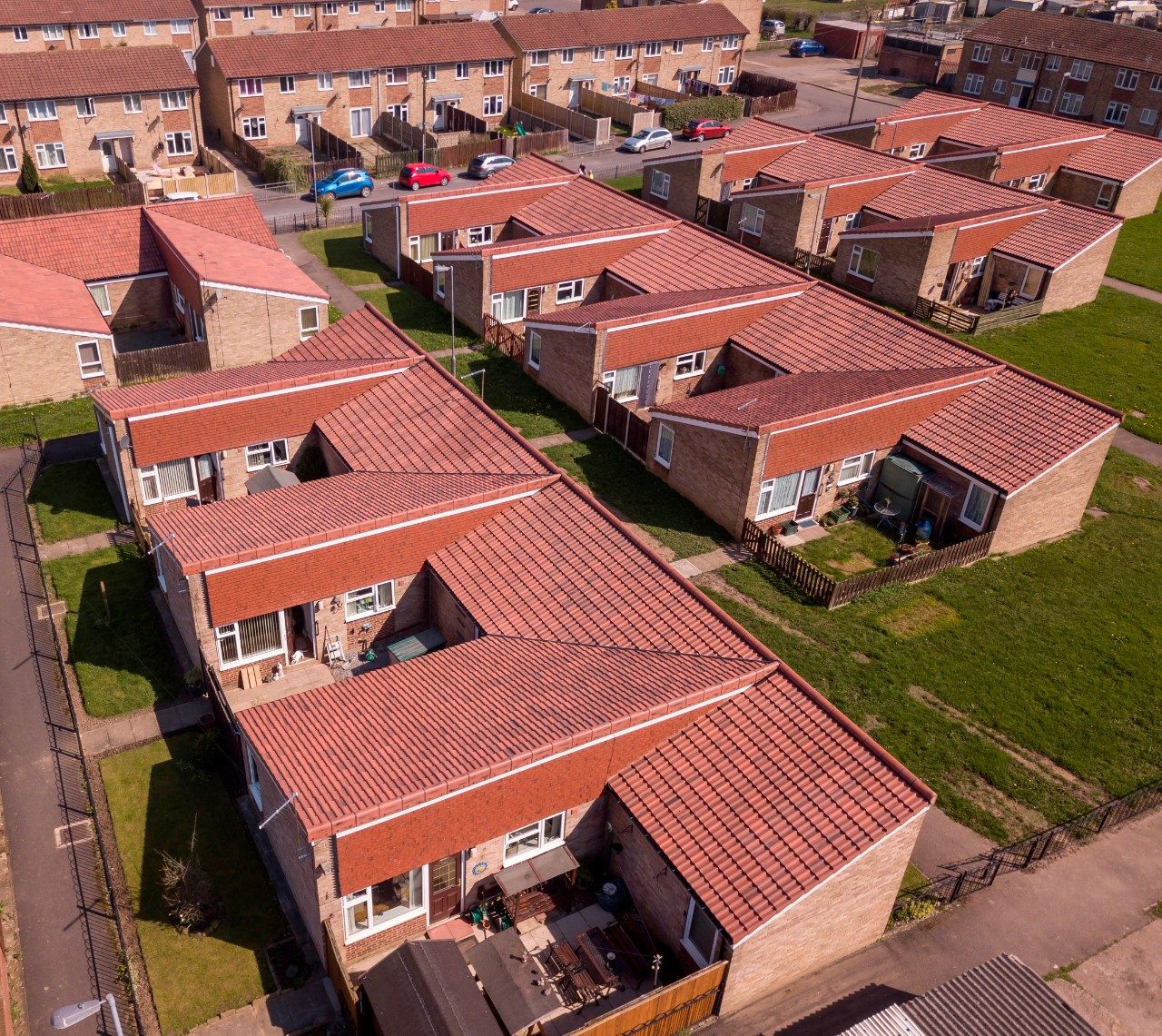 Row of terraced houses with red roofs