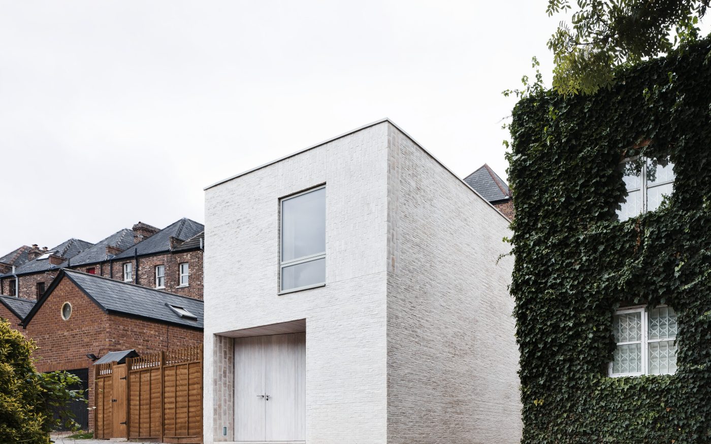 Striking modern white brick house in London mews