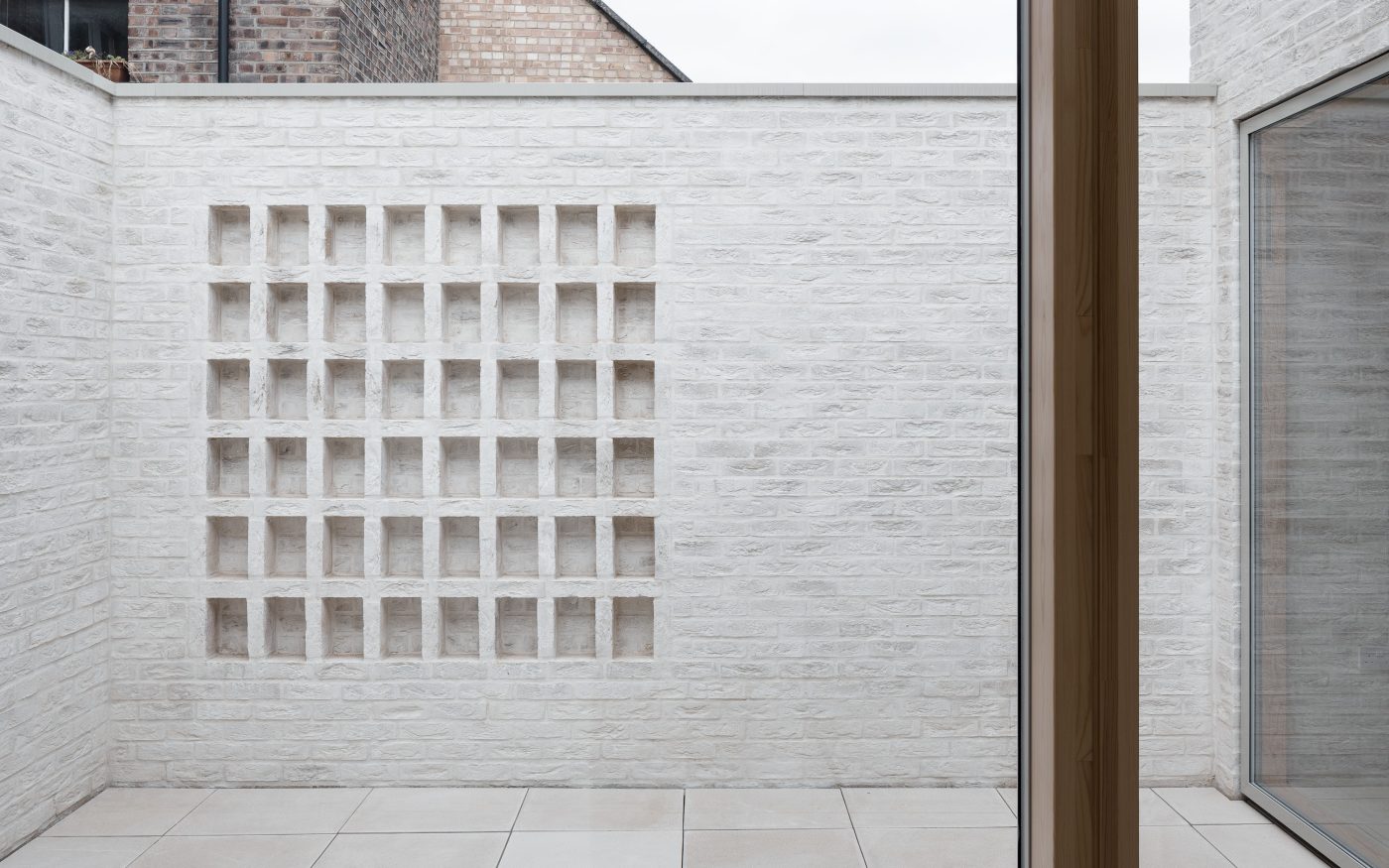 Brickwork pattern in wall of courtyard garden