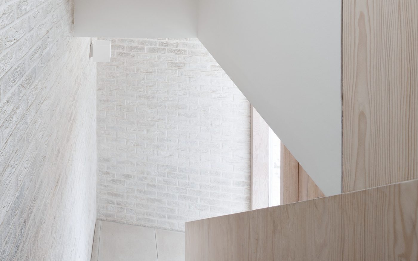 View from top of wooden staircase in modern minimalist house