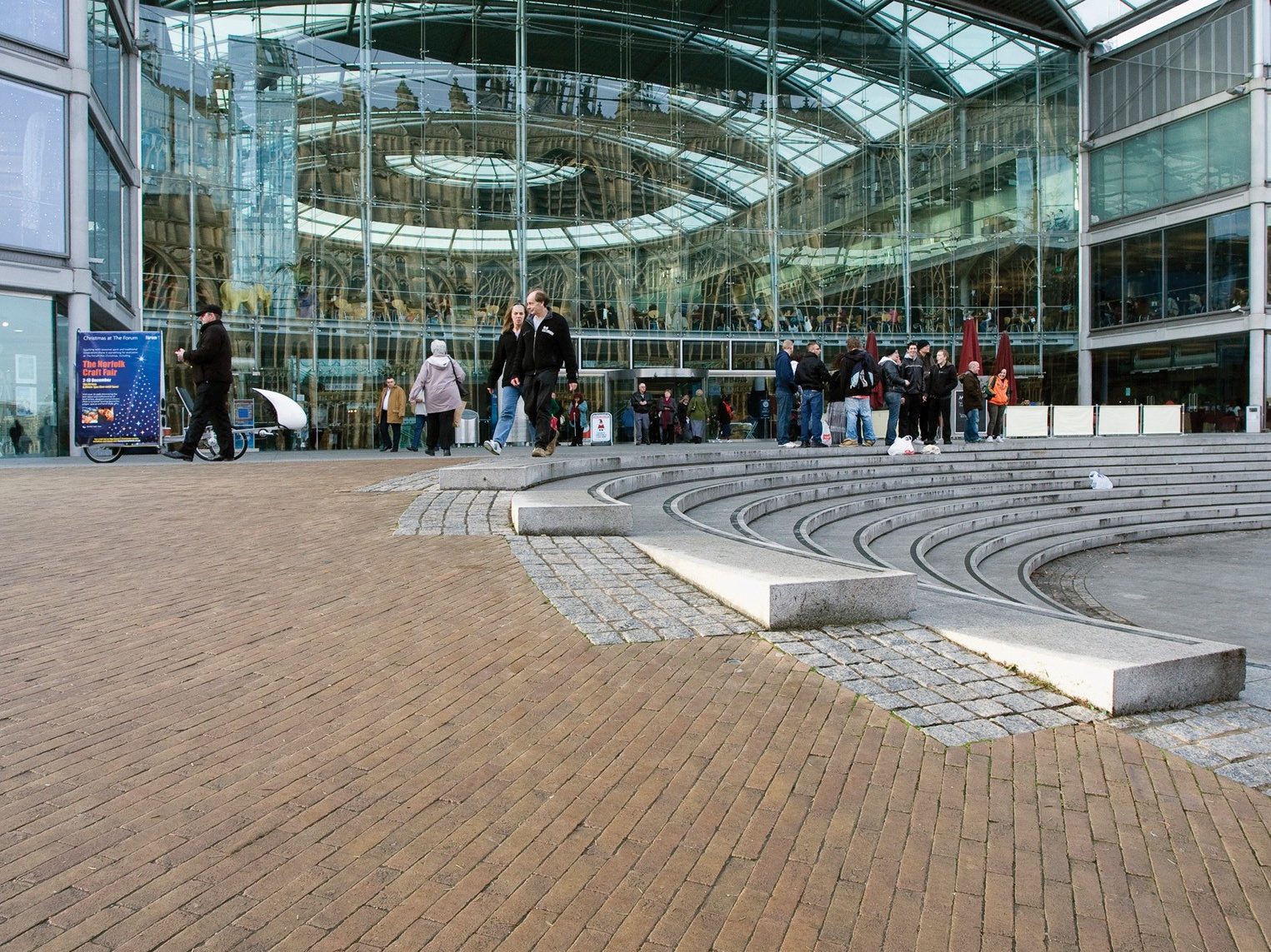 Paved courtyard area with shoppers