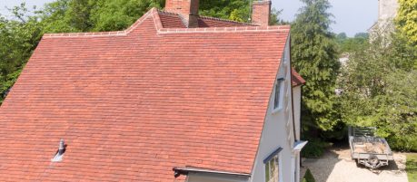 Red tiled roof on large country home
