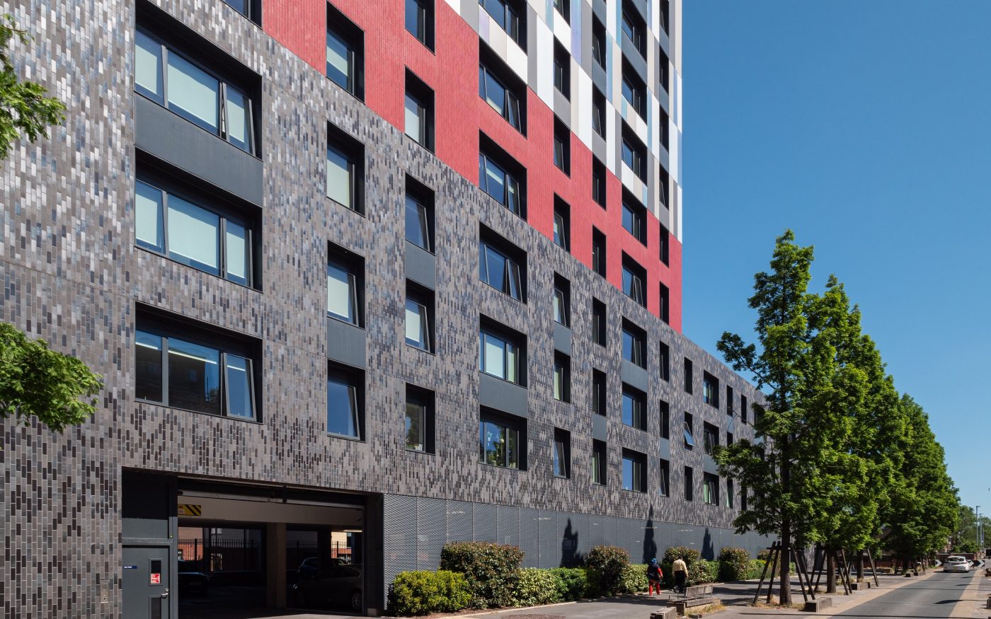Brick tile cladding on outside of modern apartment building