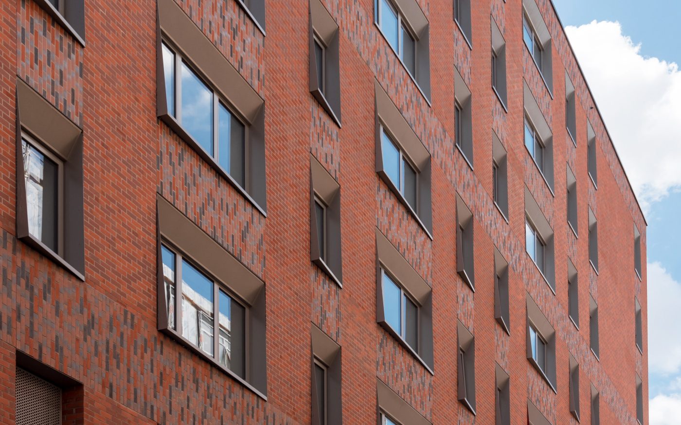 Flour Building modern apartment building with large windows and brick walls