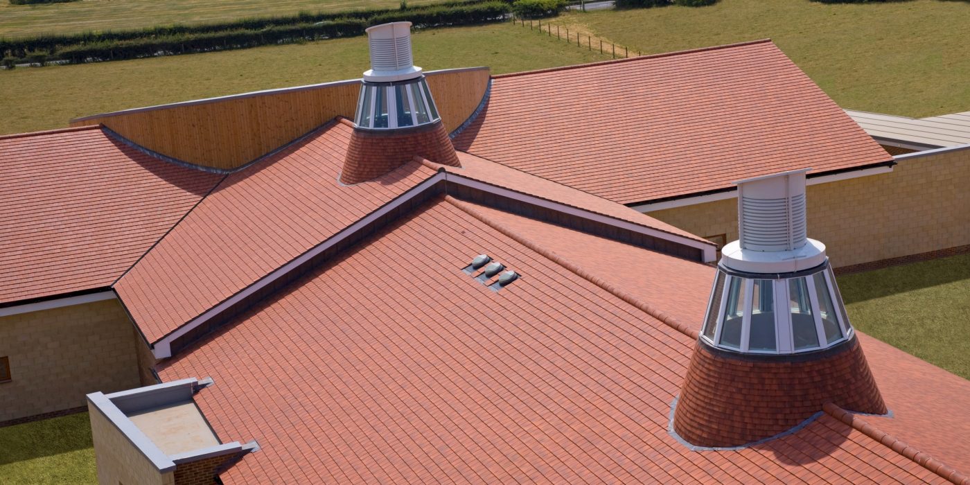 An image of low pitch roofing used on Hadlow College. 